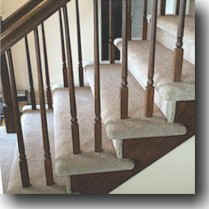 Flight of Stairs with spindles and double-wrapped carpet - Homefloorguide.com
