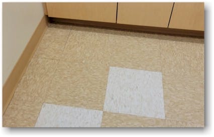 Vinyl Composition Tile (VCT) installed in a clinical application for durability and easy maintenance. Homefloorguide.com